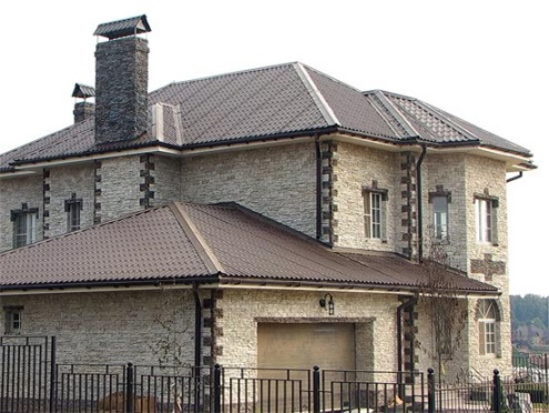 Оформление дымохода камнем