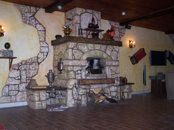 Русская печь, облицованная бутовым камнем